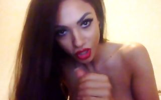 Slutty dolled up chick jerking off big fake dick webcam